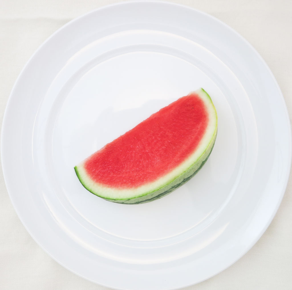 CUT WHOLE WATERMELON INTO PIECES AND STORE IN THE FRIDGE FOR A HEALTHY AND ACCESSIBLE SNACK.